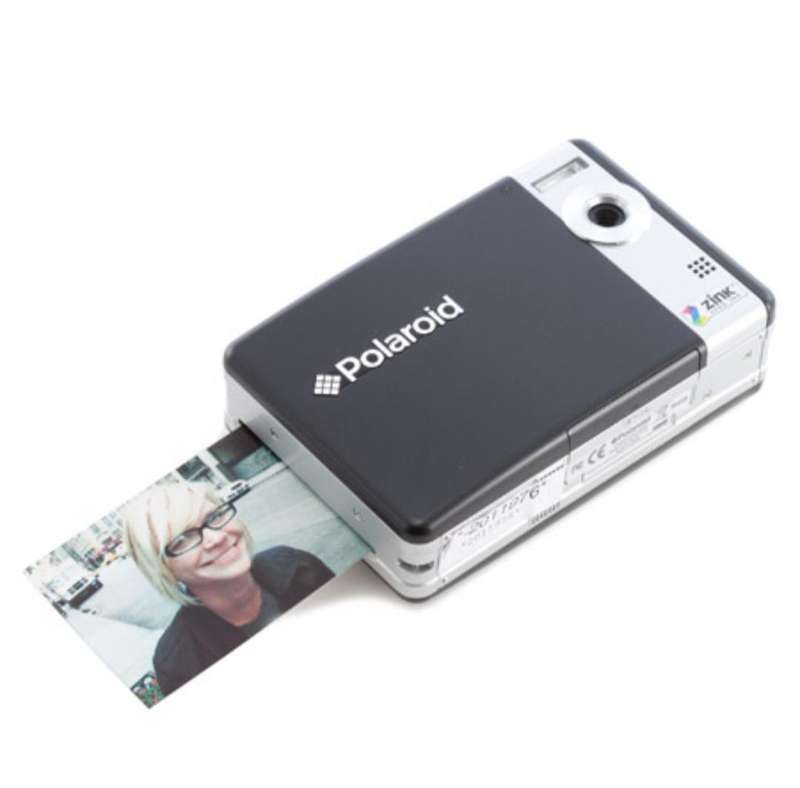 Poloroid Pogo instant digital camera (LIKE NEW) still has plastics on the camera.