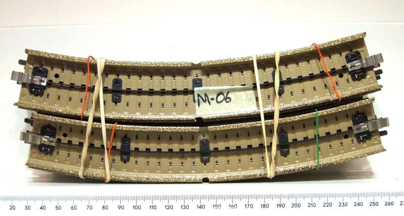 MARKLIN HO:  12pc Metal Curved M-Track with Metal Underlay in Good, Used Condition.(W Germany)