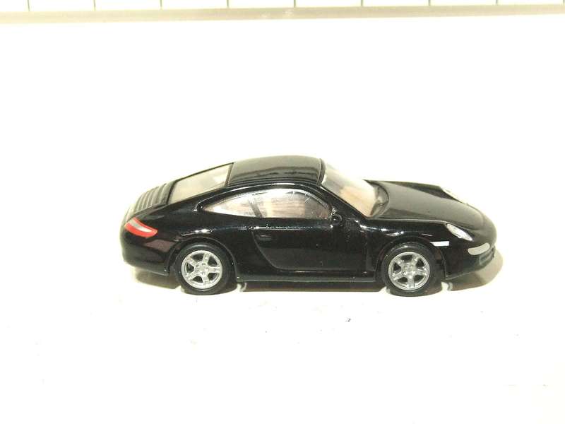 SCHUCO HO: Highly Detailed Porsche Carrera S in Very Good Un-Boxed Condition.