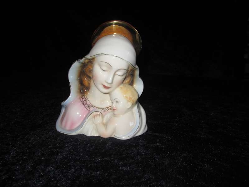 Italian Madonna and Child. 2 very small flea bites and a manufacturing defect as indicated.