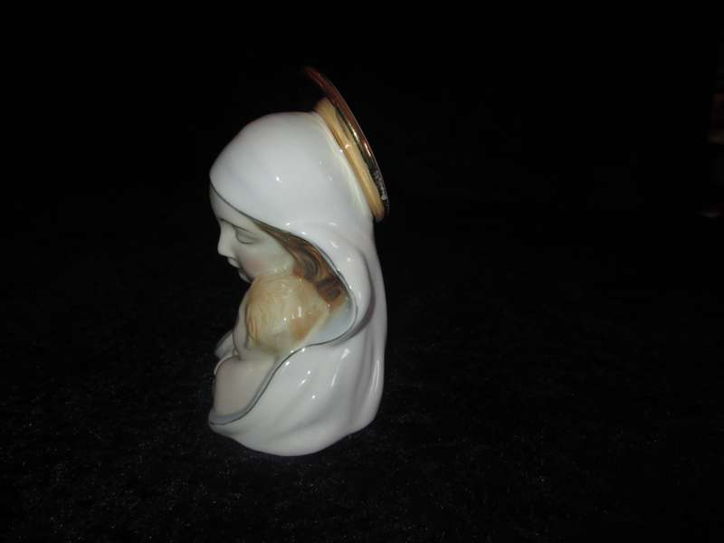Italian Madonna and Child. 2 very small flea bites and a manufacturing defect as indicated.