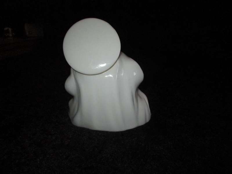 Italian Madonna and Child. 2 very small flea bites and a manufacturing defect as indicated.