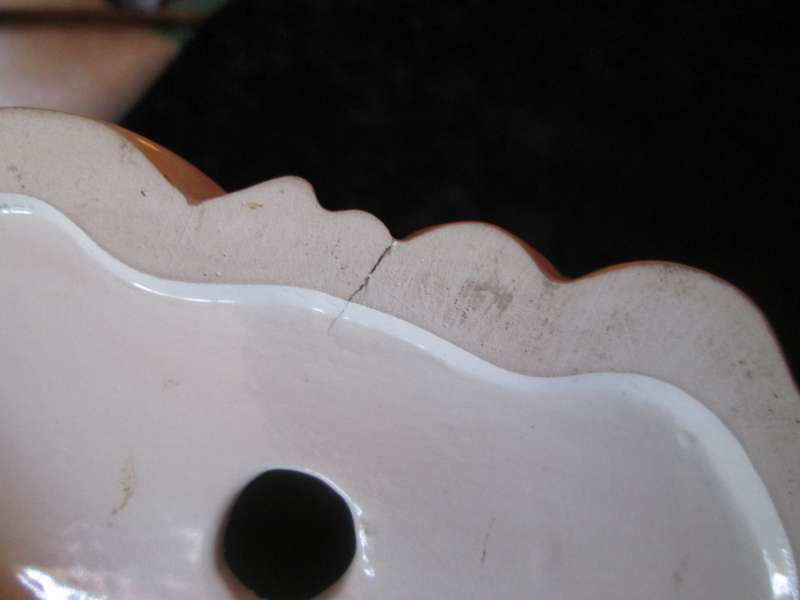 Italian Madonna and Child. 2 very small flea bites and a manufacturing defect as indicated.