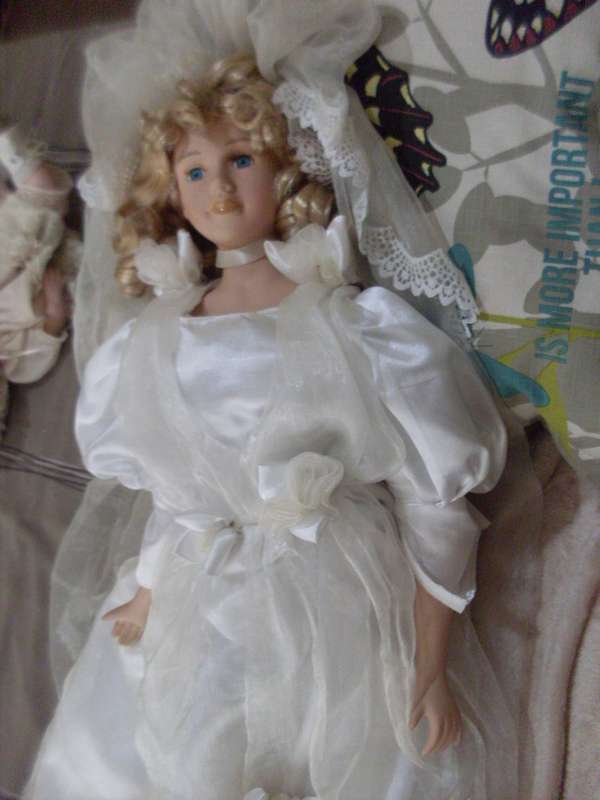 DRESSED BRIDE PORCELAIN DOLL....62 CM...WITH STAND