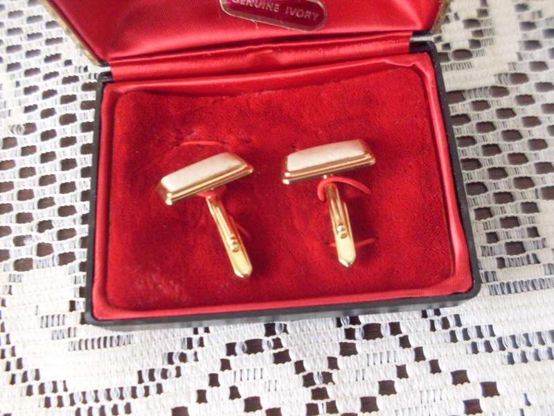 BOXED....A PAIR OF GENUINE IVORY CUFFLINKS...GOLD TONE