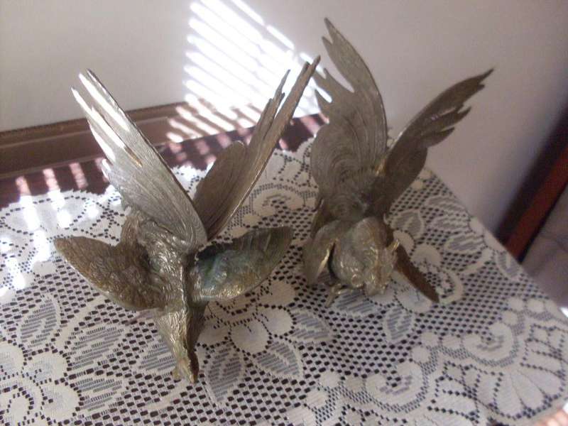 A PAIR OF LARGE SILVER PLATED FIGHTING BIRDS