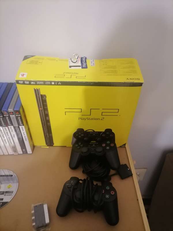 PS2 BUNDLE - CONSOLE - 2 x REMOTES AND 21 PS2 GAMES - 100% ORIGINAL - 100% WORKING LIKE NEW