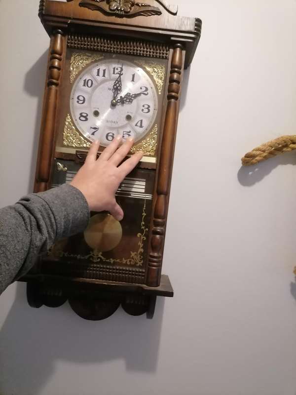 A vintage Blessing 31 day clock w/ day & date in a wood wall casing. Lifespace Sale - With Key