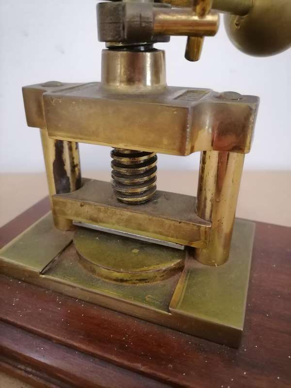 SCHAEFER BRASS NUT PRESS, 20TH CENTURY, THE CENTRAL SCREW SUPPORTED ON TWO COLUMNS, CAST MARK SCHAEF