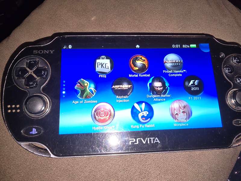 PS Vita Console - with 64gb memory card - some scuffing on back and front