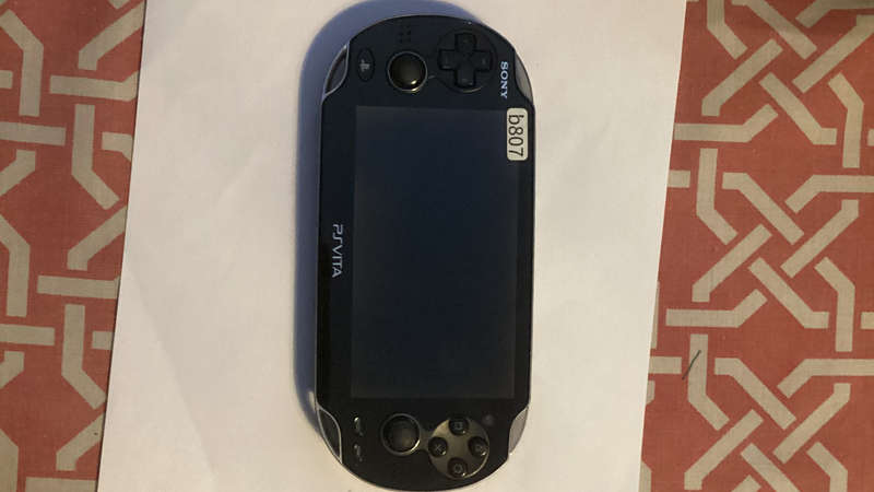 PS VITA PCH-1104 - sold with 128gb psvita pro memory card (adaptor) and charger (B807)