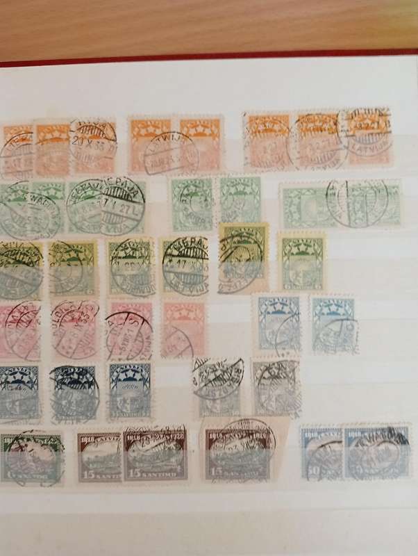 STOCK BOOK WITH GOOD EARLY LATVIA,LITHUANIA AND ESSTI-MUST SEE MANY PAGES BELOW