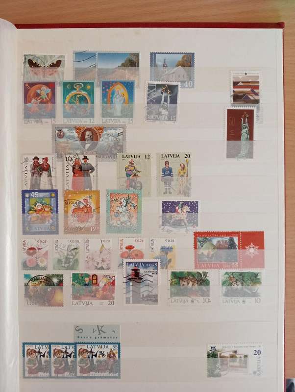 STOCK BOOK WITH GOOD EARLY LATVIA,LITHUANIA AND ESSTI-MUST SEE MANY PAGES BELOW