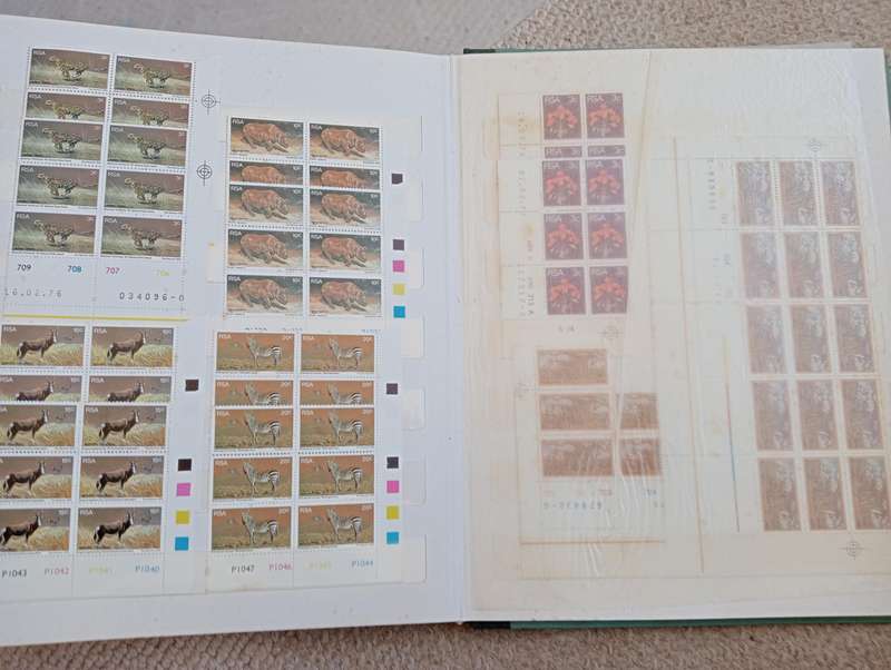 TWO stockbooks with some CLEAN SWA wars + coronation mint,others MOST of Union has degrees of toning