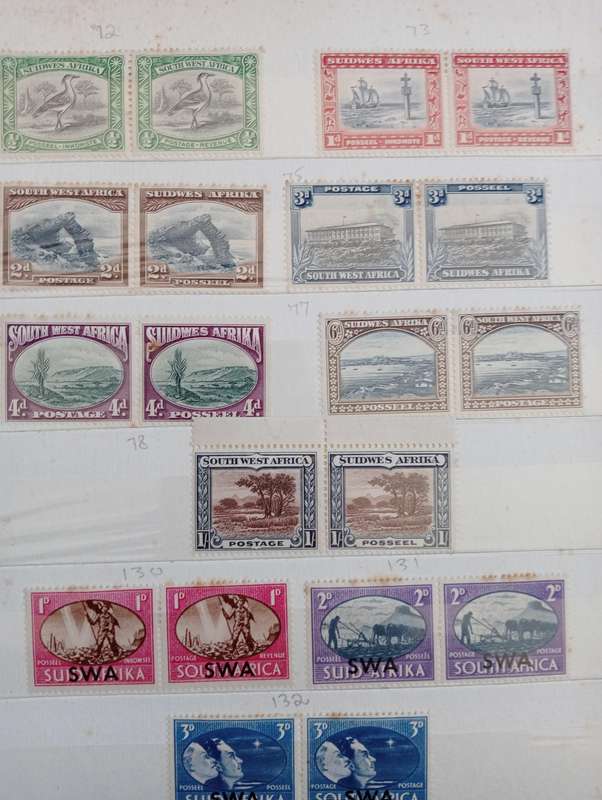 TWO stockbooks with some CLEAN SWA wars + coronation mint,others MOST of Union has degrees of toning