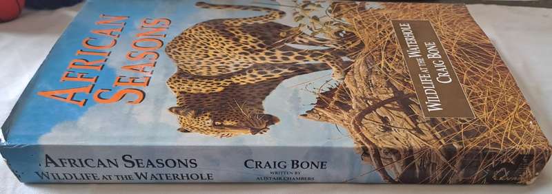 Wildlife at the Waterhole (African Seasons) - Craig Bone  :Hard Cover with DJ