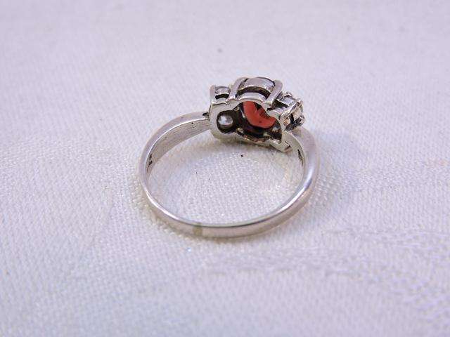 Sterling Silver Ring with Garnet & 2 x fair sized Zirconia's on either side  ( Red stone )