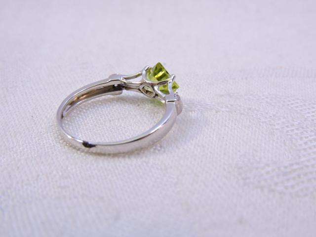 Sterling Silver Ring with Peridot & 3 x small Zirconia's on either side  ( light green stone )