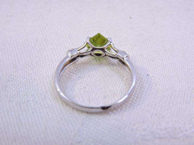 Sterling Silver Ring with Peridot & 3 x small Zirconia's on either side  ( light green stone )