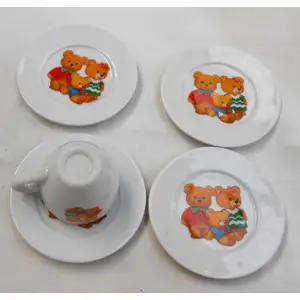 MINIATURE CHINA TEDDY BEAR CUP WITH FOUR PLATES