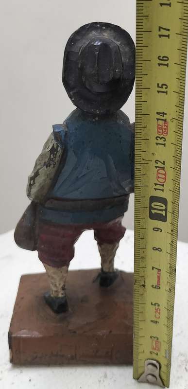 Vintage European wood carving - Sancho Panza standing on book