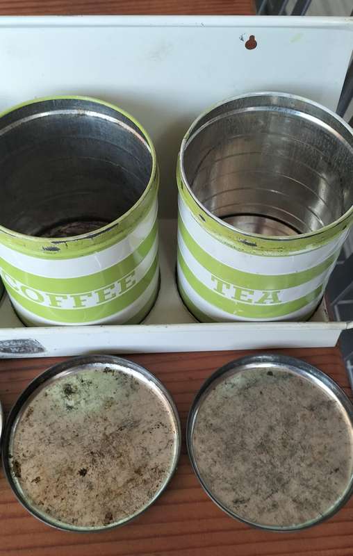 Set of Goodhope Ware kitchen canisters with metal shelve