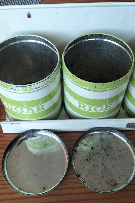 Set of Goodhope Ware kitchen canisters with metal shelve