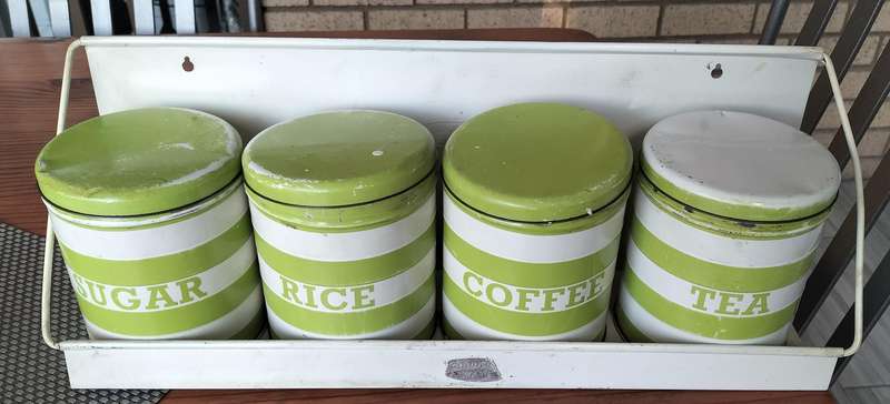 Set of Goodhope Ware kitchen canisters with metal shelve
