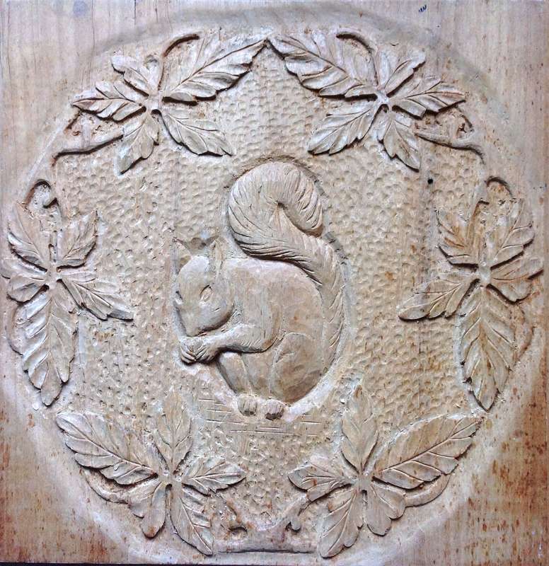 Carved Squirrel and Oak Leaves on Yellow Wood