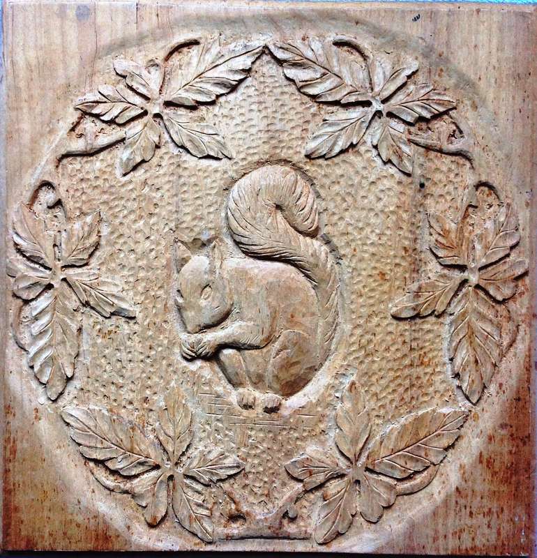 Carved Squirrel and Oak Leaves on Yellow Wood