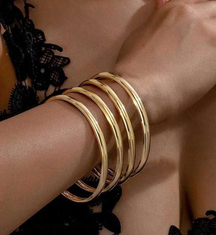 4 piece stackable metal bangles in colour gold