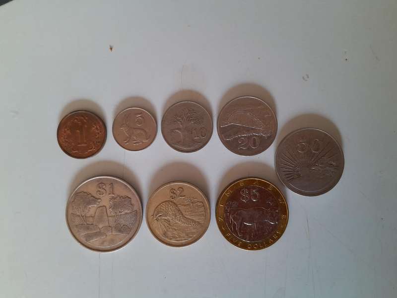 Zimbabwean Coins - 1 Cent, 5 Cents, 10 Cents, 20 Cents, 50 Cents, 1 Dollar, 2 Dollar and 5 Dollar.