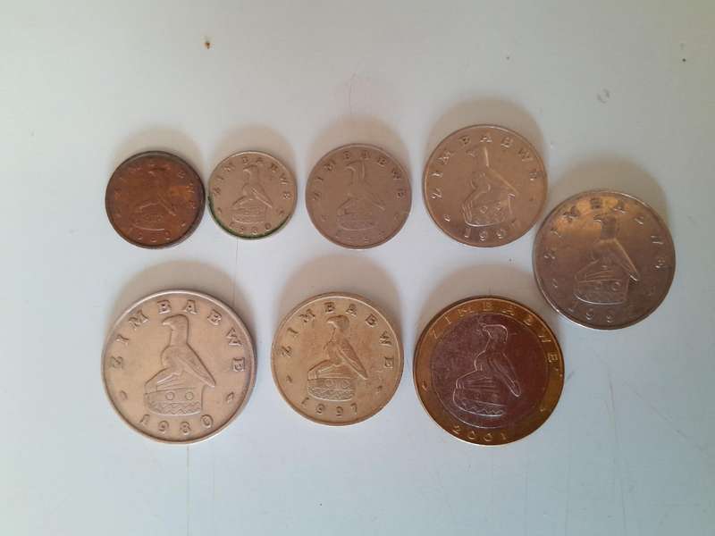 Zimbabwean Coins - 1 Cent, 5 Cents, 10 Cents, 20 Cents, 50 Cents, 1 Dollar, 2 Dollar and 5 Dollar.