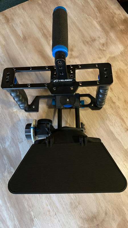 Universal Camera Cage Rig Kit with ND filter holder attached. Grip handles, cold shoe follow focus.
