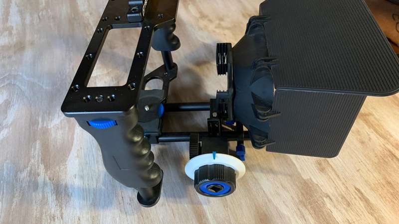 Universal Camera Cage Rig Kit with ND filter holder attached. Grip handles, cold shoe follow focus.