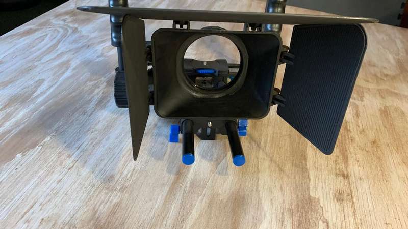 Universal Camera Cage Rig Kit with ND filter holder attached. Grip handles, cold shoe follow focus.