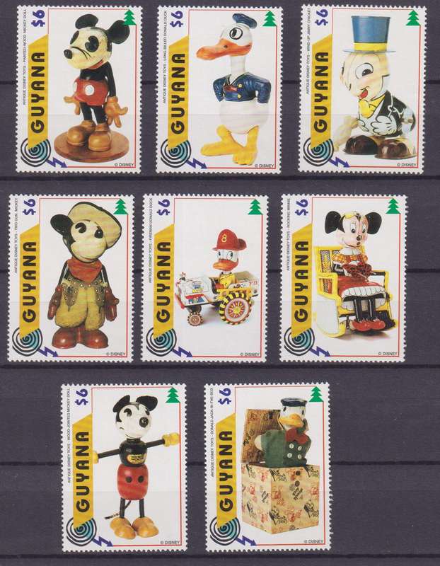 8 DISNEY STAMPS - VINTAGE DISNEY TOYS - GUYANA