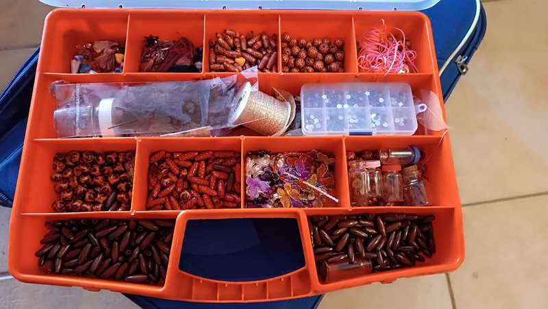 Beads with container and book