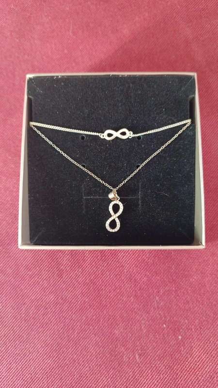 Sterling silver with cubic Zirconias Infinity Necklace and matching Bracelet