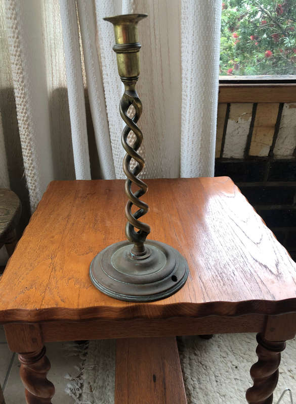 CANDLESTICK BRASS BARLEY TWIST ON CIRCULAR BASE WITH TYPICAL GLASS WAX CATCHER OF THE PERIOD