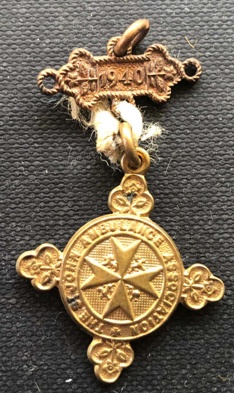 1940 ST JOHNS AMBULANCE MEDAL AND LABEL