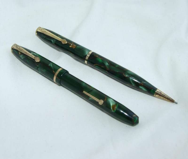 Vintage Conway Stewart "Dinkie" fountain pen and pencil green marble pair. 14ct nib.