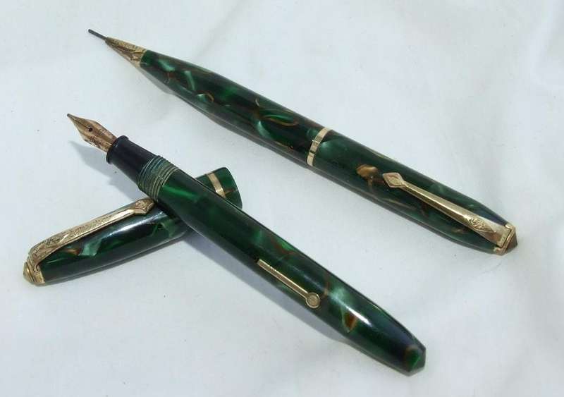Vintage Conway Stewart "Dinkie" fountain pen and pencil green marble pair. 14ct nib.