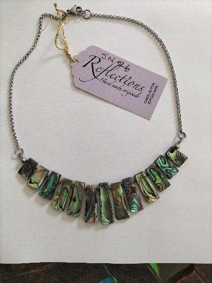 Paua Shell oblong cascade on stainless steel chain. SN27