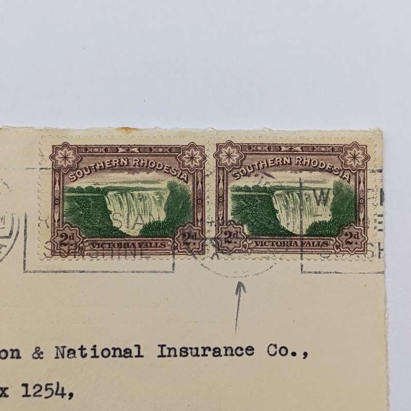 Postal Cover with pair of Southern Rhodesia Victoria Falls 2d stamps with shifted center