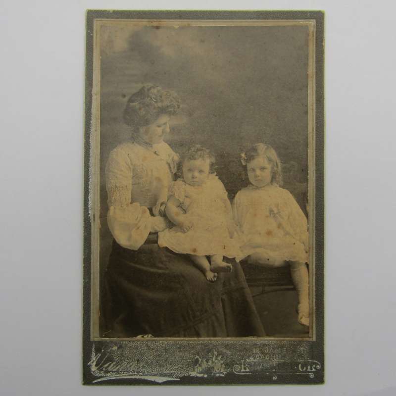 Antique photo of mother and two children