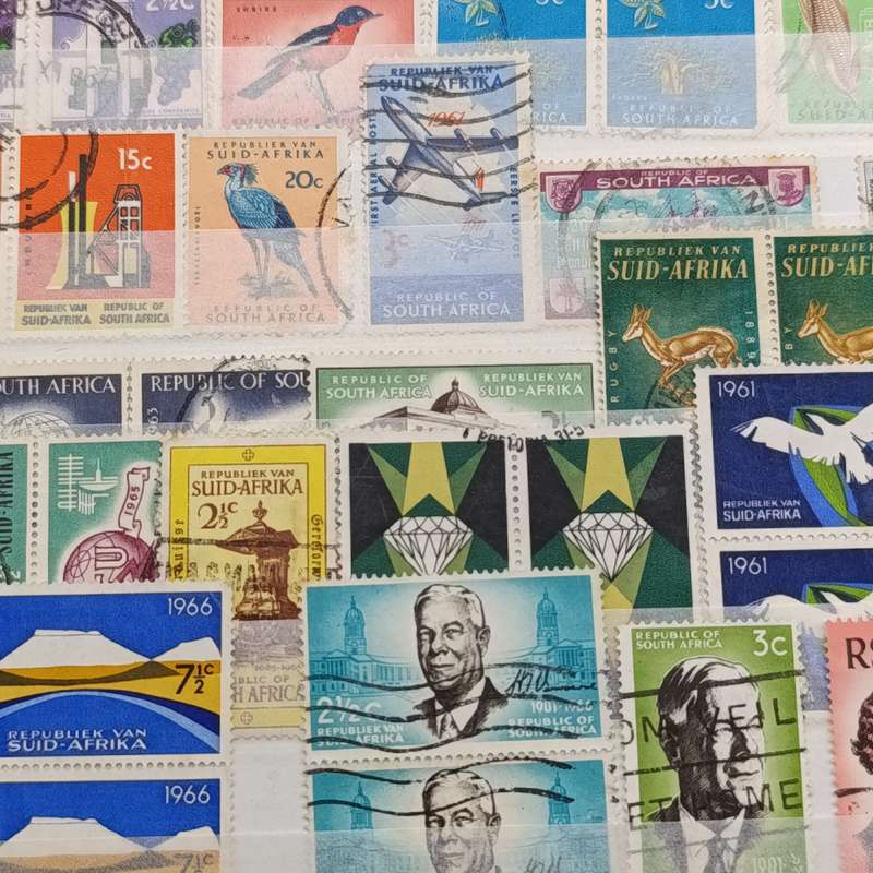 Album - pages with over 400 South African as from pre 1910 and about 240 British stamps nice stamps