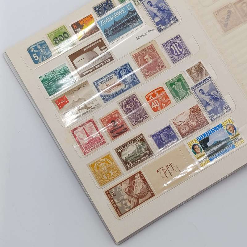 18 Page stamp world album with about 440 mint stamps - unchecked