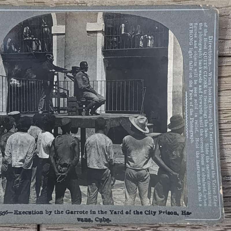 Antique stereoscope card #9956 Execution by the Garrote in the Yard of the City Prison, Havana, Cuba
