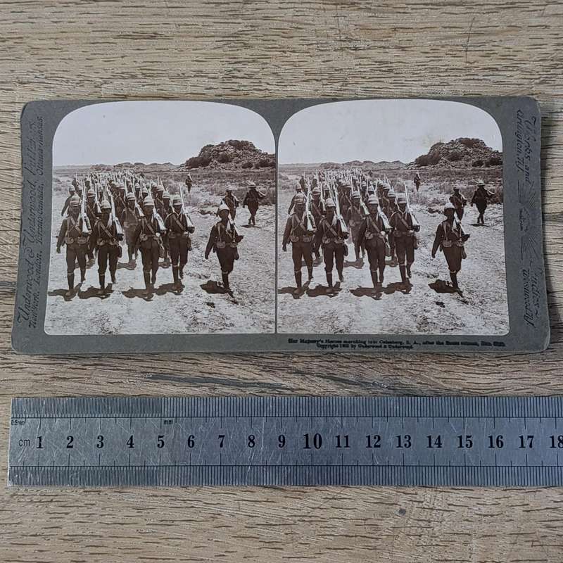Boer War stereoscope card - Her Majesty's Heroes marching into Colesberg, S.A